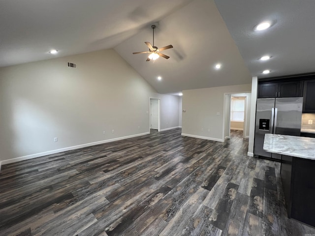 unfurnished living room featuring ceiling fan, high vaulted ceiling, and dark hardwood / wood-style floors