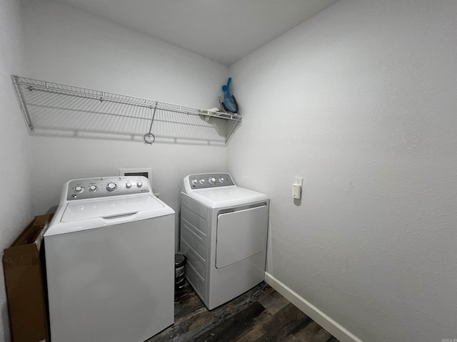 washroom featuring washer and dryer and dark hardwood / wood-style floors