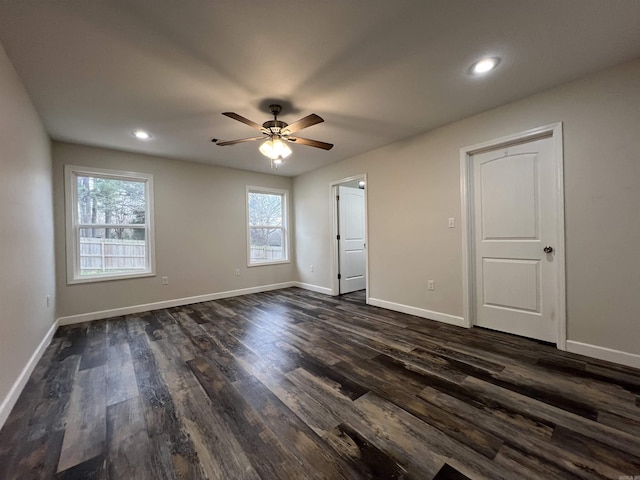 unfurnished bedroom featuring dark hardwood / wood-style floors and ceiling fan