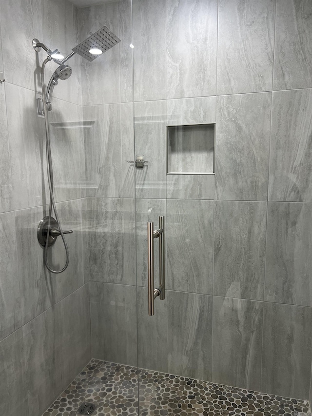 bathroom featuring an enclosed shower