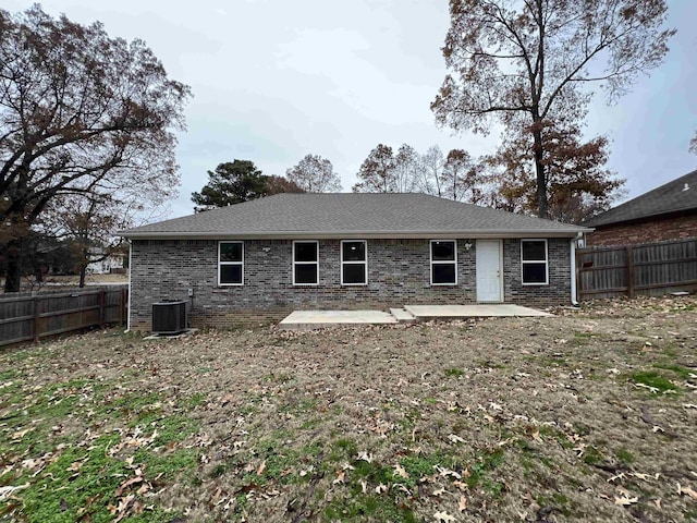 rear view of property featuring a patio area and central AC