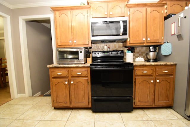 kitchen with backsplash, crown molding, light tile patterned flooring, and stainless steel appliances