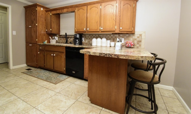 kitchen with dishwasher, a breakfast bar, backsplash, light tile patterned floors, and ornamental molding