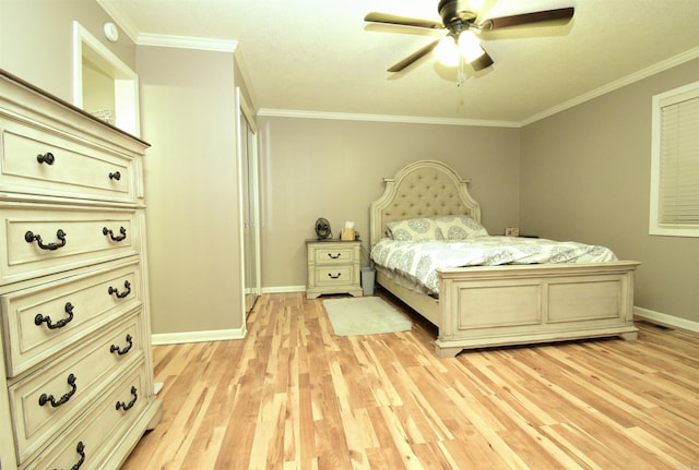 bedroom featuring ceiling fan, light wood-type flooring, and ornamental molding