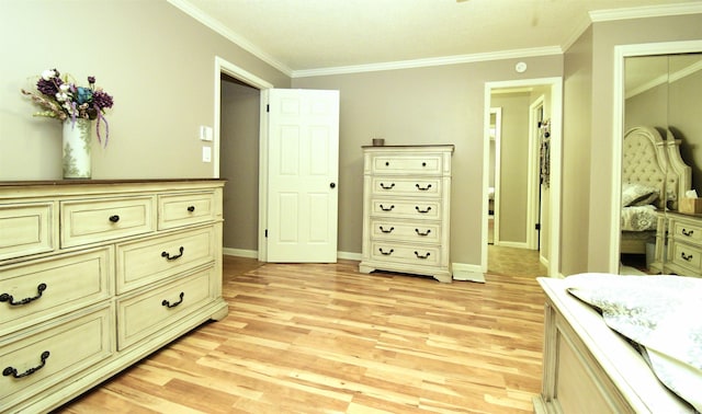 bedroom with crown molding and light wood-type flooring