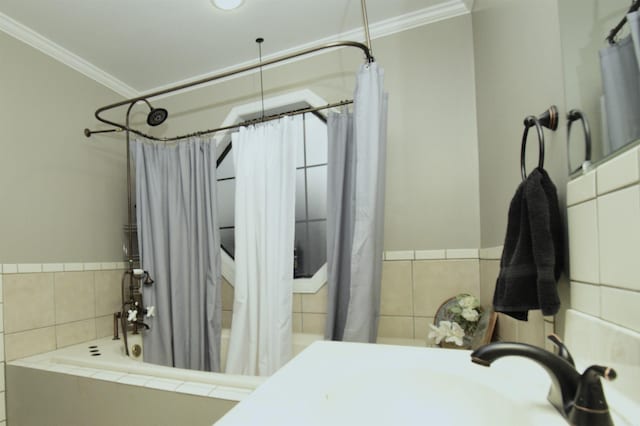 bathroom featuring shower / bath combo, ornamental molding, and sink