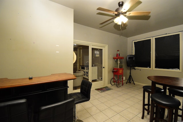 dining area featuring ceiling fan and light tile patterned floors