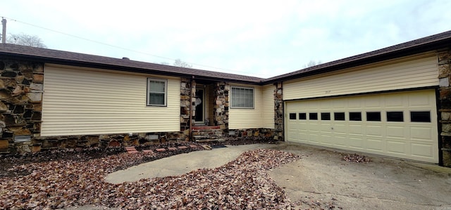 ranch-style house featuring a garage