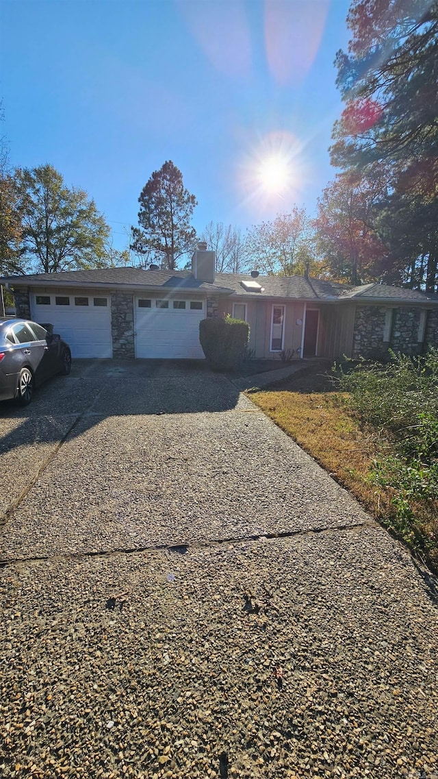 single story home featuring a garage