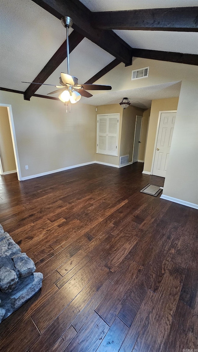 unfurnished living room featuring vaulted ceiling with beams, dark hardwood / wood-style flooring, a textured ceiling, and ceiling fan