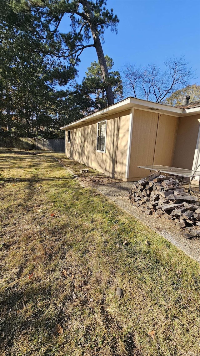 view of property exterior featuring a lawn