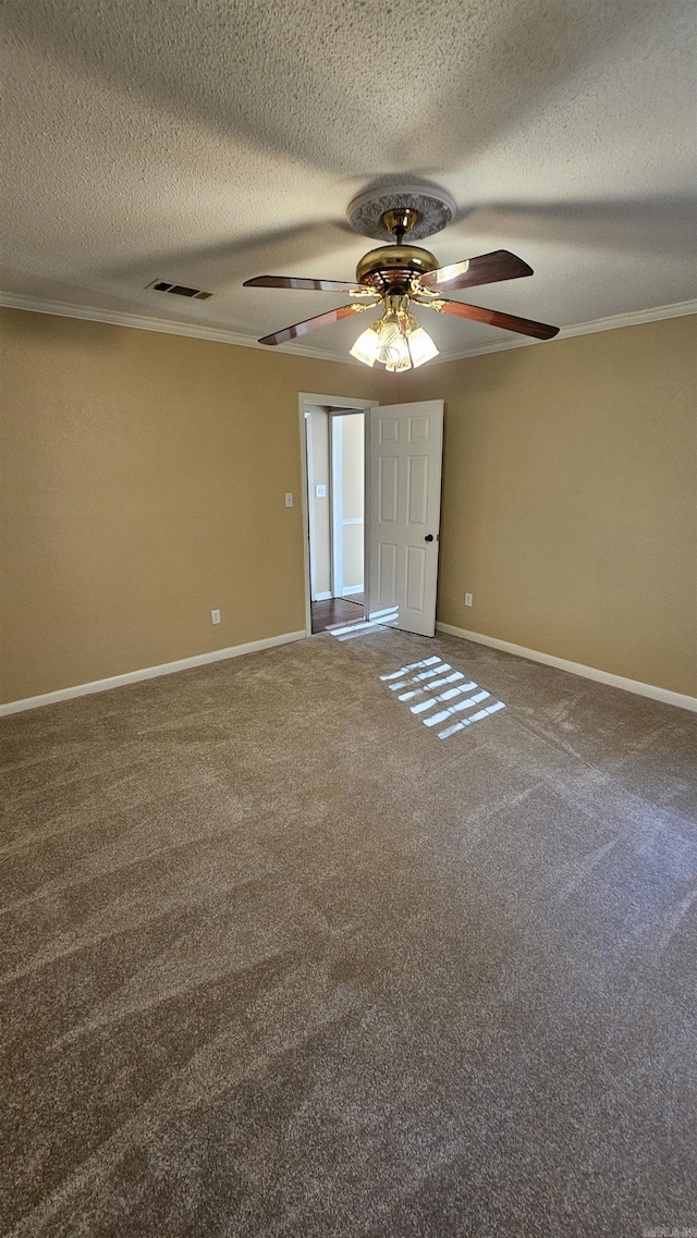 carpeted empty room with ceiling fan, a textured ceiling, and ornamental molding