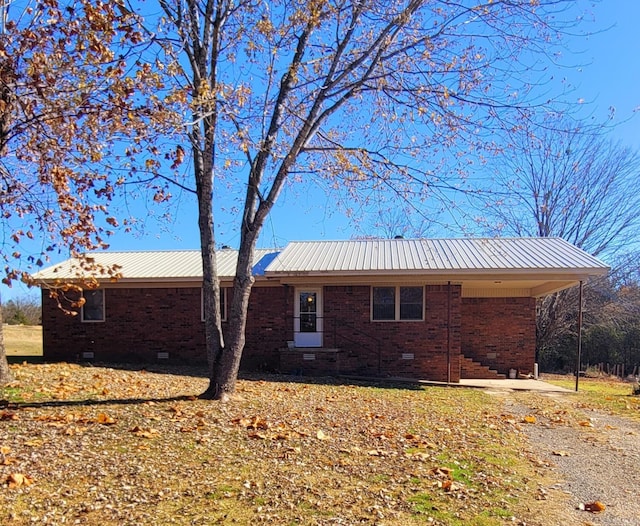 view of home's exterior featuring a carport