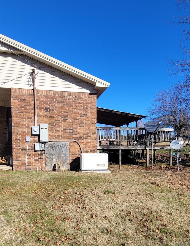 view of side of home featuring a lawn