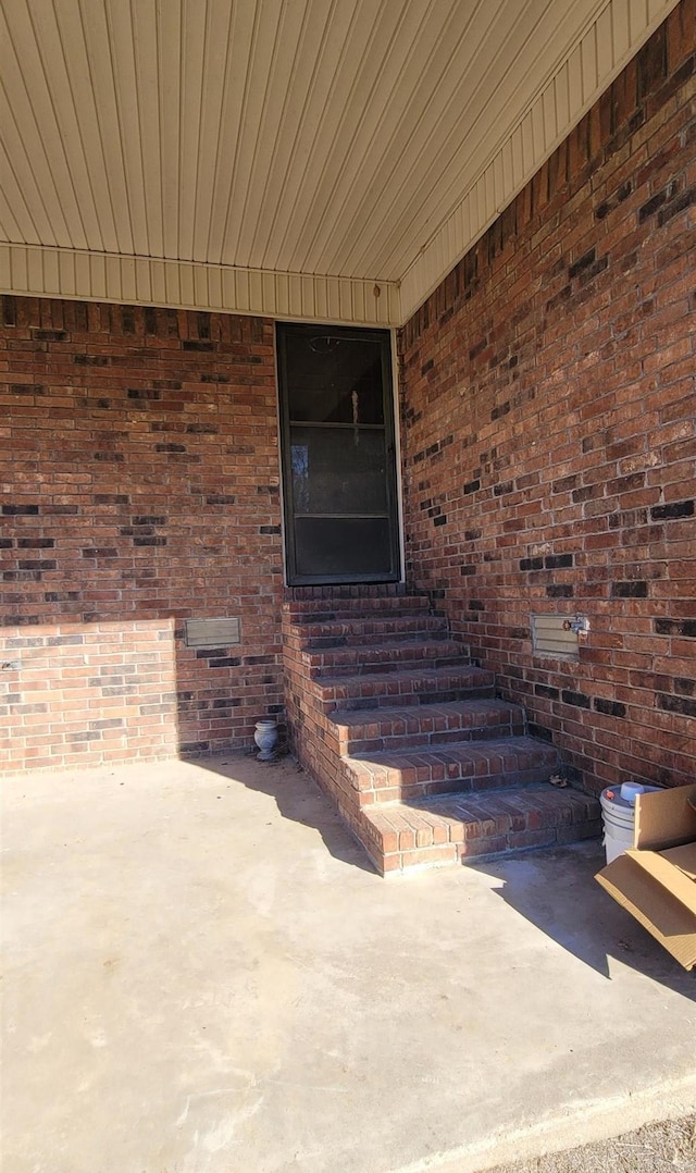 entrance to property with a patio