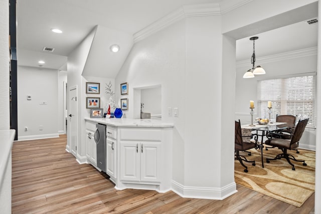 bar with white cabinets, decorative light fixtures, and light wood-type flooring