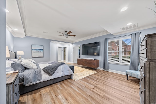 bedroom featuring ceiling fan, crown molding, and light hardwood / wood-style flooring