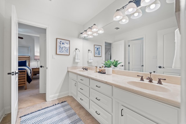 bathroom featuring tile patterned flooring and vanity