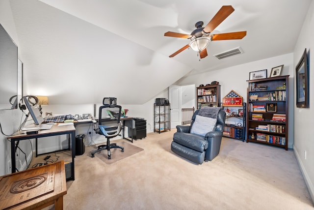 office area featuring ceiling fan, light colored carpet, and lofted ceiling