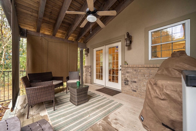 deck featuring ceiling fan and french doors