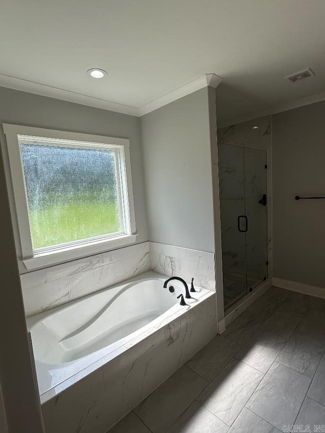 bathroom featuring separate shower and tub and crown molding