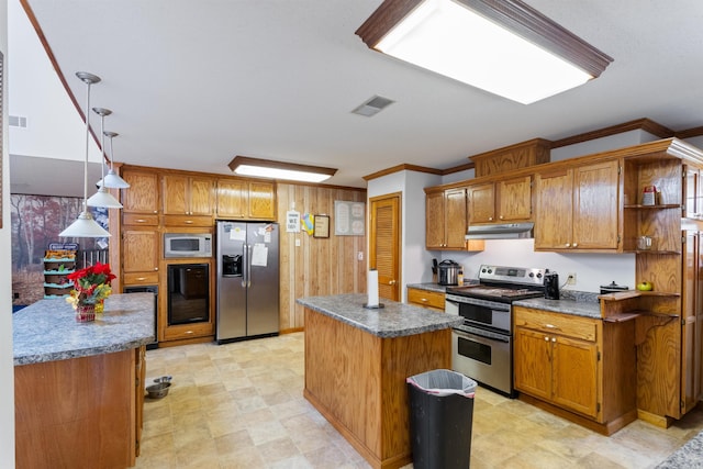 kitchen with a kitchen island, ornamental molding, hanging light fixtures, and appliances with stainless steel finishes