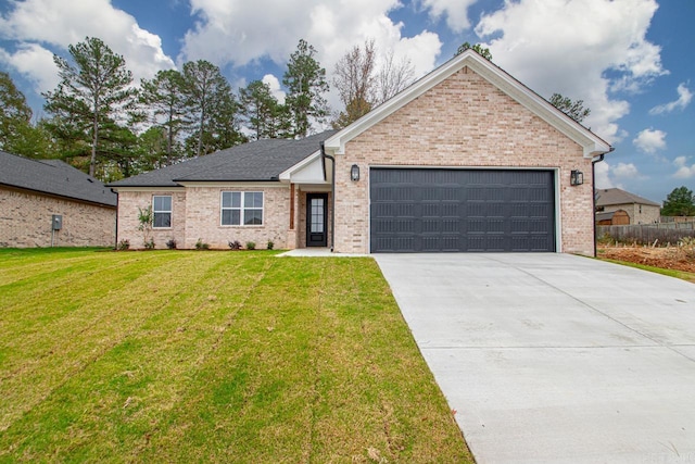 ranch-style house featuring a front yard and a garage