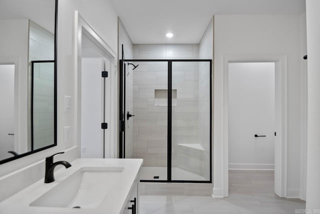 bathroom with vanity and walk in shower