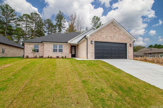 ranch-style home featuring a front lawn and a garage