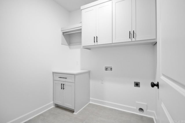 laundry room with hookup for a washing machine, cabinets, and hookup for an electric dryer