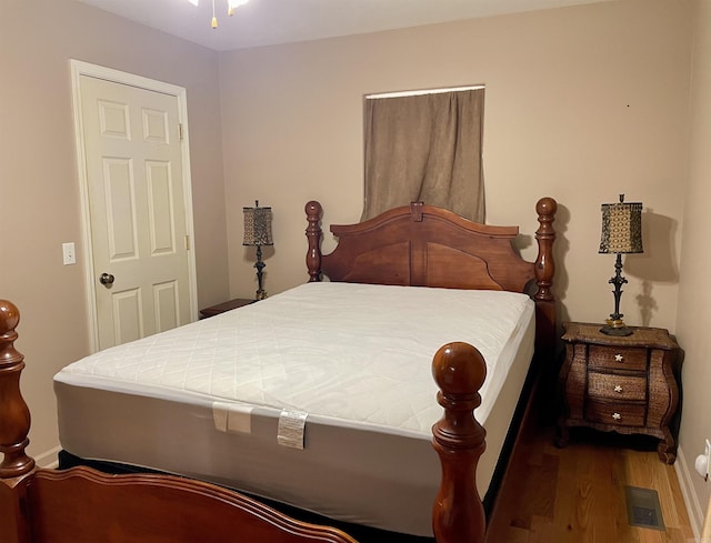 bedroom featuring wood-type flooring