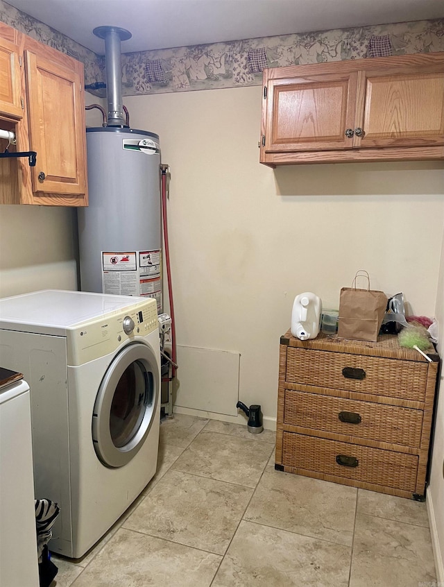 clothes washing area featuring cabinets and independent washer and dryer