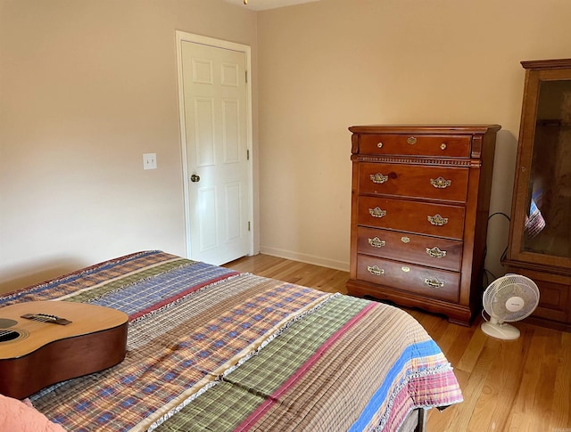 bedroom with light hardwood / wood-style flooring