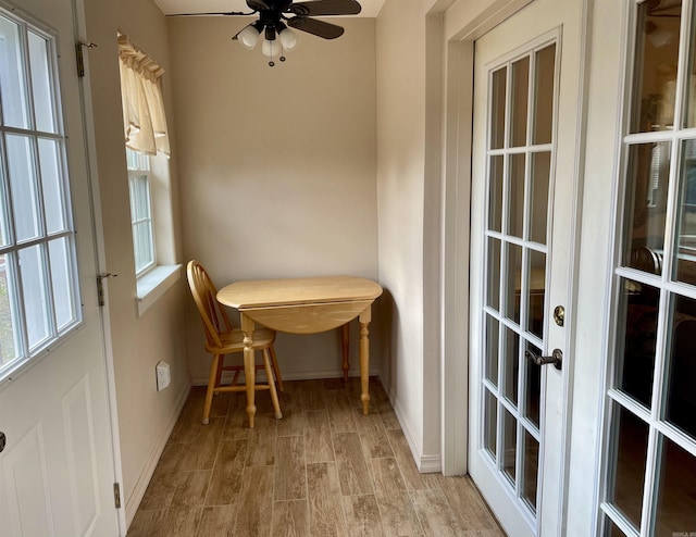 sunroom with ceiling fan and french doors