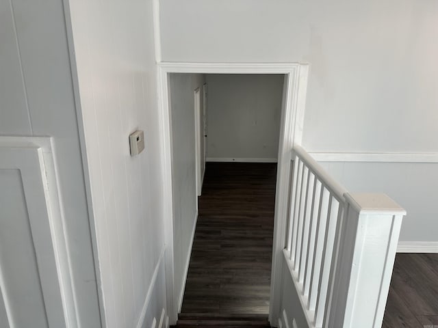 hallway with dark hardwood / wood-style floors