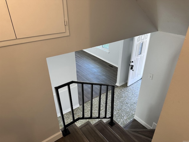 stairs with hardwood / wood-style floors