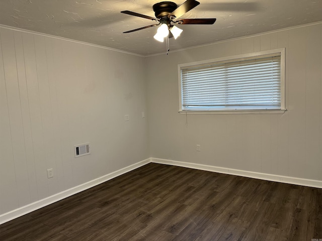 unfurnished room featuring ceiling fan, dark wood-type flooring, and ornamental molding