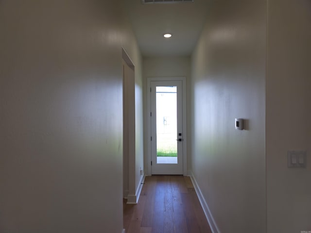 entryway with dark hardwood / wood-style flooring