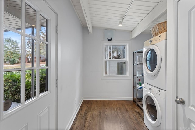 clothes washing area featuring dark hardwood / wood-style flooring, stacked washer and dryer, and wood ceiling