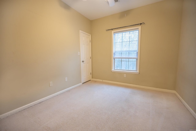 empty room with light colored carpet