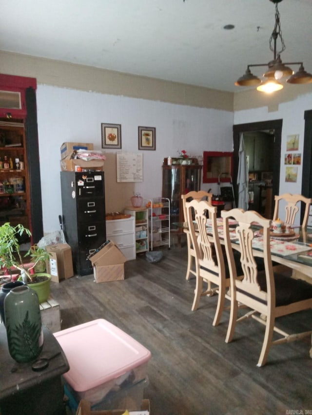 dining space featuring dark wood-type flooring