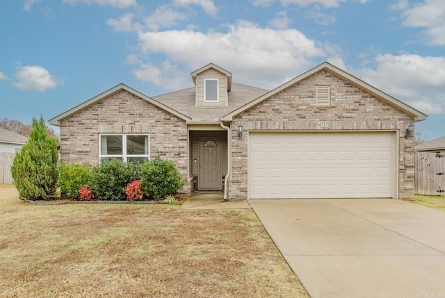 view of front of house featuring a garage and a front yard