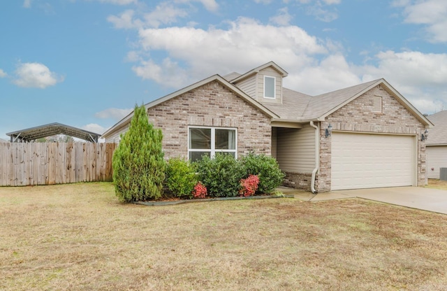 view of front of property featuring a garage and a front yard