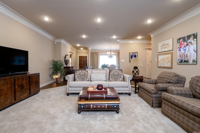 living room with carpet, crown molding, and an inviting chandelier