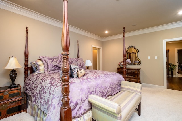 bedroom with crown molding and carpet floors