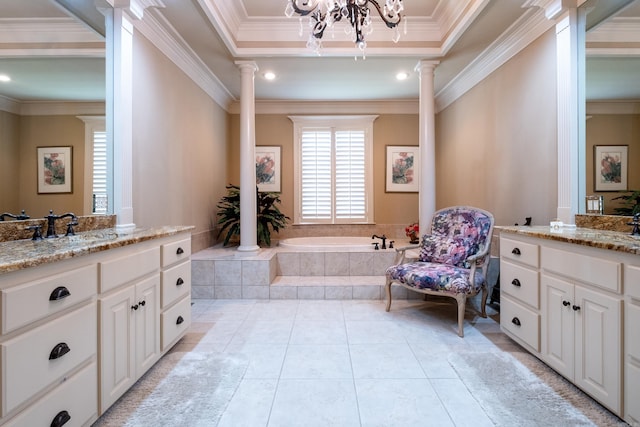 bathroom featuring vanity, decorative columns, crown molding, tiled bath, and a chandelier