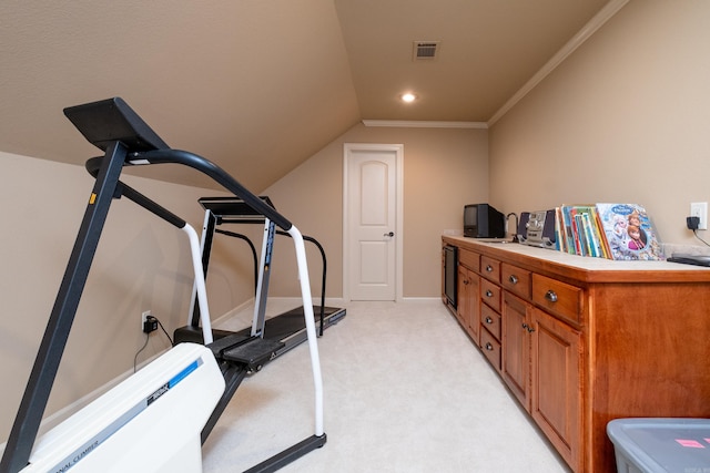 exercise room with light colored carpet, vaulted ceiling, and ornamental molding