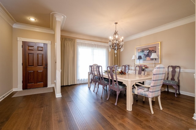 dining area with dark hardwood / wood-style flooring, an inviting chandelier, and crown molding