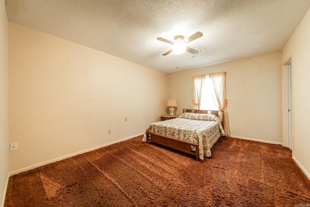 bedroom with dark colored carpet, a textured ceiling, and ceiling fan