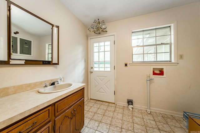 entryway featuring sink and light tile patterned floors